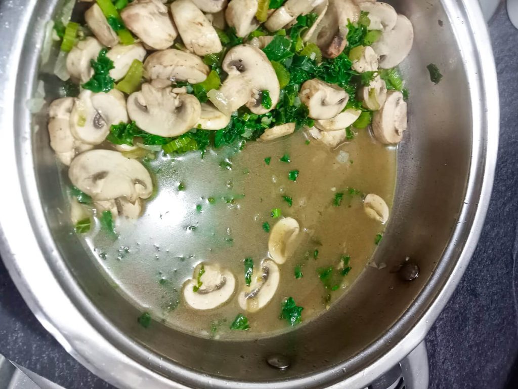 Process photo- vegetable broth added to the pot.