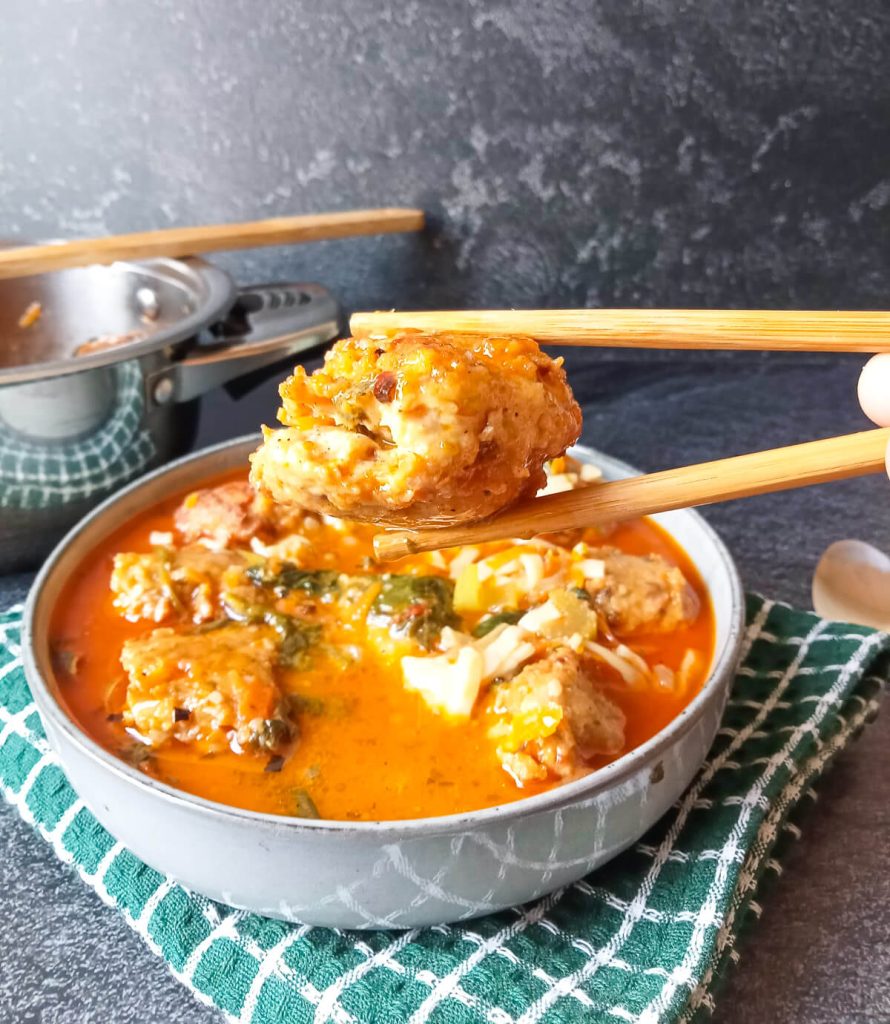 A close up shot of meatball from the Thai chicken meatball soup.