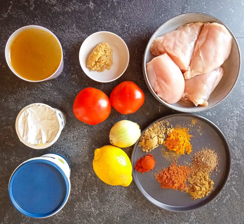 Ingredients photo: chicken, tomatoes, onion, lemon, yogurt, cream, chicken broth, garlic, spices and ginger paste