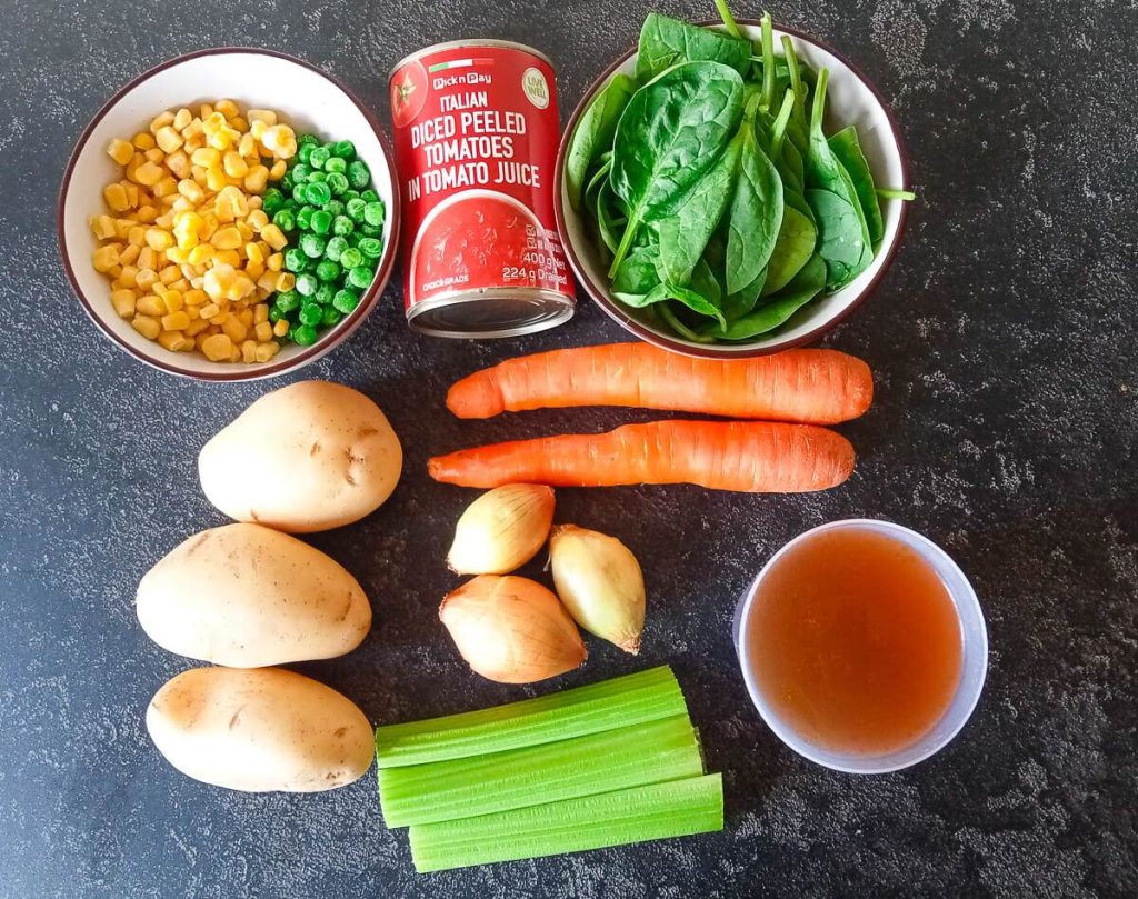 Ingredients photo: sweetcorn, peas, canned tomatoes, baby spinach, carrots, onions, potatoes, celery, and bone broth.