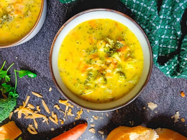 A bowl of broccoli rice soup with a lifestyle scene on a black background.